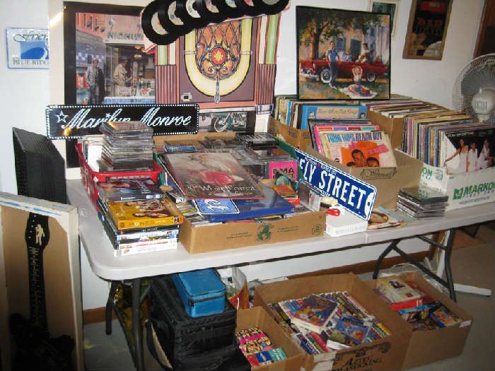 Large Selection of Albums, 45's, CD's, DVD's, VHS Tapes, Cassettes and Related Musical Prints & Metal Signs