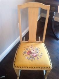 Vintage painted rocker with beautiful needlework and nail heads.