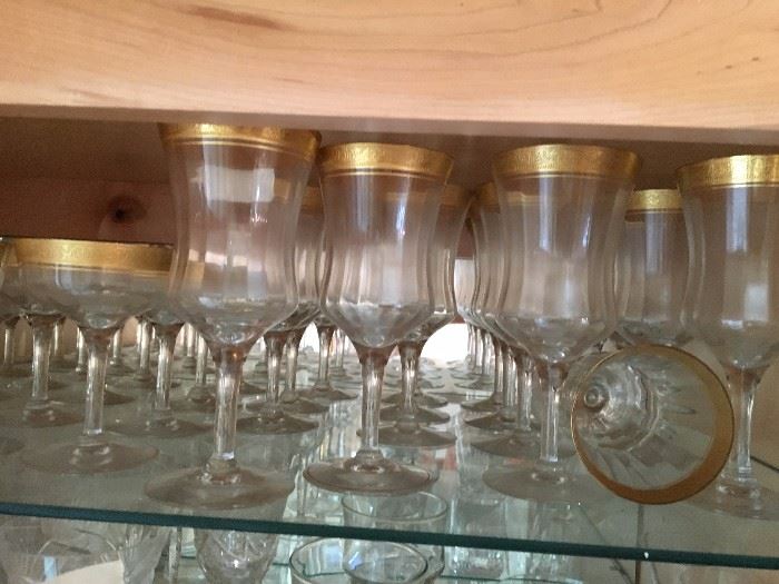 Gold-rimmed antique glasses in several sizes