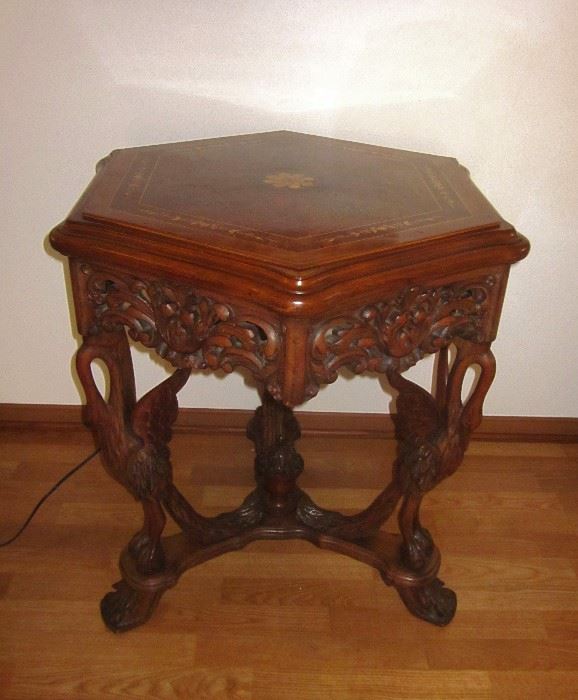 Vintage ornate, high relief carved, rosewood table with 3 mythical swan legs, beautifully inlaid hexagon top, really nice condition!  Measures 29" wide and 30" tall.