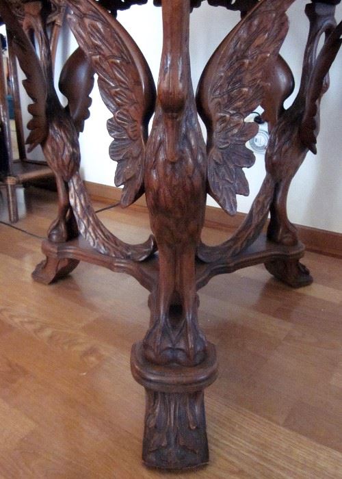 Vintage ornate, high relief carved, rosewood table with 3 mythical swan legs, beautifully inlaid hexagon top, really nice condition!  Measures 29" wide and 30" tall.
