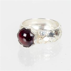 Sterling Silver Ring with Garnet: A sterling silver ring with garnet.