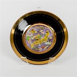 Vintage 24KT Gold Edged Chokin Japanese Plate: A vintage 24KT gold edged Chokin Japanese plate. This decorative plate depicts a map of Japan with various icons. The interior edge and exterior edge are lined in a 24KT gold trim. The back is marked 24KT Gold Edged and describes the ancient Chokin practice. Stand not included.