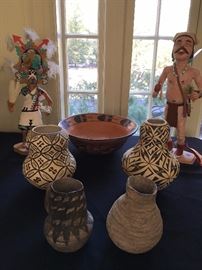 Jessie Garcia Acoma Vase (left and right center), Early Coil Pot (front right), Snowflake Black on White Pitcher circa 1100 (front left), Navajo Clown by Larson Onsae (back right), Hopi Bowl by Garnet Pavatea (back center), Butterfly Girl Kachina by William James (back left)