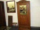 Circa 1890, solid oak armoire with beveled mirror. Made in Grand Rapids, Mi. In excellent, original finish condition!