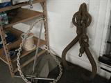 Large, heavy logging tongs. And a large boat anchor with rubber coated heavy chain.