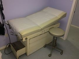 Dr exam table   dr. stool   located at the clinic 