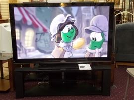 A Panasonic 65" plasma Viera TV with stand and manual in excellent condition, (2010).