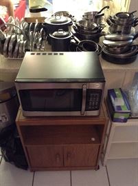 Practically new Microwave. and simple microwave stand. Many pots and pans.... Don't forget your lids. 