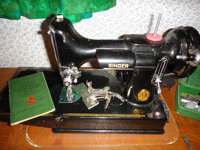 Singer Sewing machine( 221-1), Accessories and cabinet,  Excellent condition 