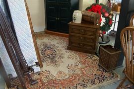 The following items are located in the large enclosed garage area. This picture shows an oriental rug, the nightstand that matches the bed (shown in next picture)