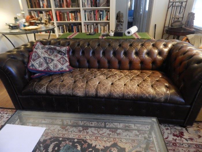 Chesterfield sofa in leather and naturally aged via the Labrador. Cool piece!