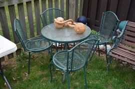glass top table and four chairs