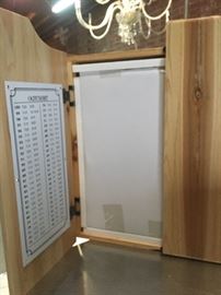 Inside of dartboard cabinet.
