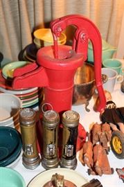 Small red cast iron water pump with vintage flash lights