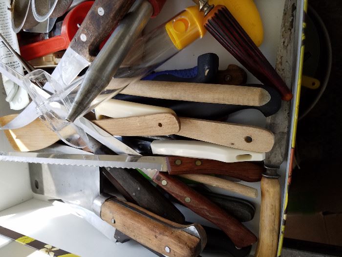 drawer full of kitchen knifes and other essential cooking tools 