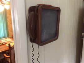 Vintage wall telephone with chalkboard side
