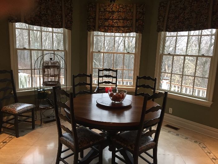 Round kitchen tabl perfect for that kitchen nook.  Six chairs included.