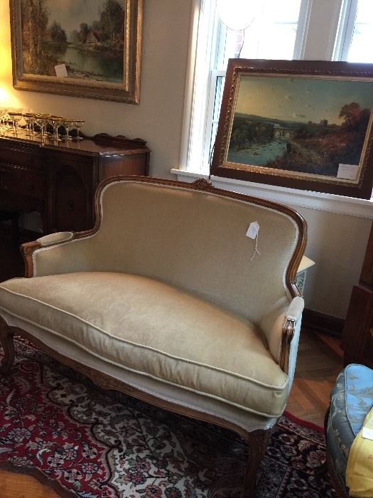    one of two French style settees