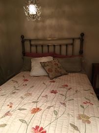 Quilt decorative  pillows bed and headboard.