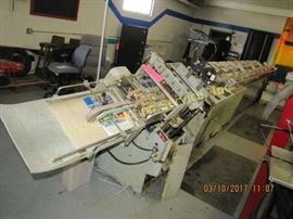 Macey multibinder from Harris-Seybold Company, 9
station, cataloging/binding machine, staple bind (WORKS), 29' long, misc parts/pcs There will be an extended removal for lots 5, 12, 50 & 52. You may contact the following for moving: Olinger Rigging & Machinery Moving 816-231-4922 or mwhite@olingerheavyhauling.com Huddleston Machinery Moving, LLC 816-231-4147 or liftit@hmmkc.com
