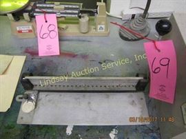 Small metal shelf & a hole punch