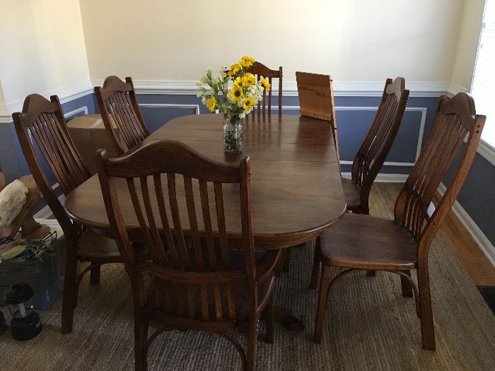 Perfect condition dinning set handmade solid with 2 inserts 2 capitan chairs and 4 side chairs. 
