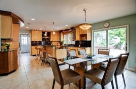 Black Galaxy Granite and wood dining table with two leaves. Paid $3000, Asking price $800. Super comfortable chairs that we love, wipeable and easily cleanable.  Poly fabric that is soft and comfortable. Chairs are sold as a set $700. 