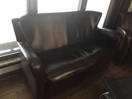 Bonded leather love seat.
