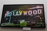 #44 - Steve Kaufman - Hollywood - Hand Embellished on Canvas, 47/50. Measures 34 by 21 framed and the image is 32 by 19.
Steve Kaufman was a contemporary of Andy Warho, acting as his assistant at Warhol's studio, "The Factory". In 1993, his "Art Studio" moves to Los Angeles, California and starts a new style called "Comic Book Pop Art". He was the first artist to form a bridge between Marvel Comics (Spider-Man) and DC Comics (Superman). Works with Stan Lee, who autographed the edition.