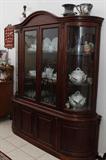 China cabinet with two center glass doors and two side curved glass door panels and two wooden doors and two side wooden curved panels