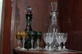German colored wine decantor and wine glasses on left
