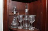 crystal wine decantors with wine glasses. One of several sets.