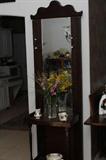 old oak hall tree with large mirror and porcelain hooks for hats