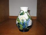 small Moorcroft vase with blue flowers