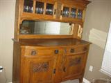 English Oak buffet - Art Nouveau sideboard, circa 1900, bow glass top cupboards, original beveled mirror, carved motifs on doors.