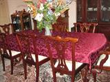Dining Room Table and Chairs and flower arrangement in crystal vase