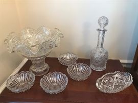 Cut Glass Lot with decator, 4 matching bowls, a bowl on pedestal and an oval bowl.  Nice touch to any gathering.