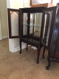 Curio Cabinet: 22" x 11" x 40", mirrored backing, glass shelf, 2 doors with handles and cherry wood