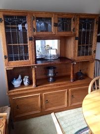 This beautiful antique hutch is in 2 pieces and is a marriage. There are a couple of scratches on the left panel of glass. It is 5.5' wide