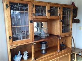 This beautiful antique hutch is in 2 pieces and is a marriage. There are a couple of scratches on the left panel of glass. It is 5.5' wide