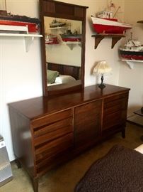 Wow, love this vintage dresser. And check out those incredible fishing ships again!