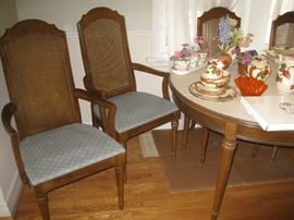 Cane back captain chairs matching dining room table