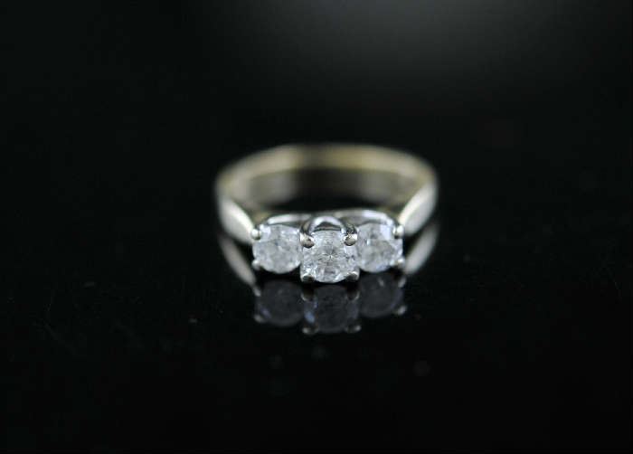 Lot 1: 14k yellow gold three stone diamond ring, center stone, approx. .35ct with other two .30ct