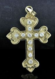 Lot 8: 14k cross with diamonds