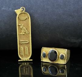 Lot 19: 22k gold ring set with stones, 6.8 grams with an 18k gold pendant, 8.5 grams