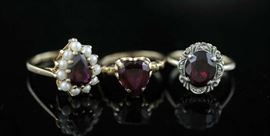Lot 29: Three gold rings set with red stones