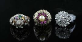 Lot 31: Three 14k gold rings; two with diamonds and colored stones, 12.5 grams
