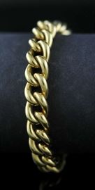 Lot 33: 18k gold linked bracelet, 28 grams, 8"L.