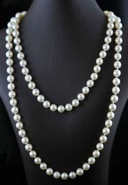 Lot 35: Fine 32" long cultured pearl necklace, 14k gold clasp, 7-7.5 mm